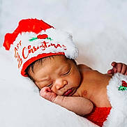 Salux joined the competition — help win amazing prizes! newborn, baby, sleeping, christmas_hat, holiday, festive, red, white, blanket, soft, cute, infant, cozy, portrait, peaceful, resting, holiday_theme, fur_trim, hat, child