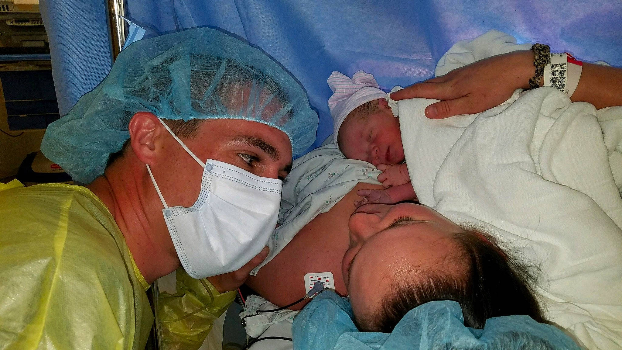 Brock is registered to the contest to win money with this photo: baby, child, childbirth, comfort, event, health_care, health_care_provider, hospital, hospital_gown, medical, medical_procedure, mouth, nursing, organ, patient, person, scrubs, service, skin, surgeon