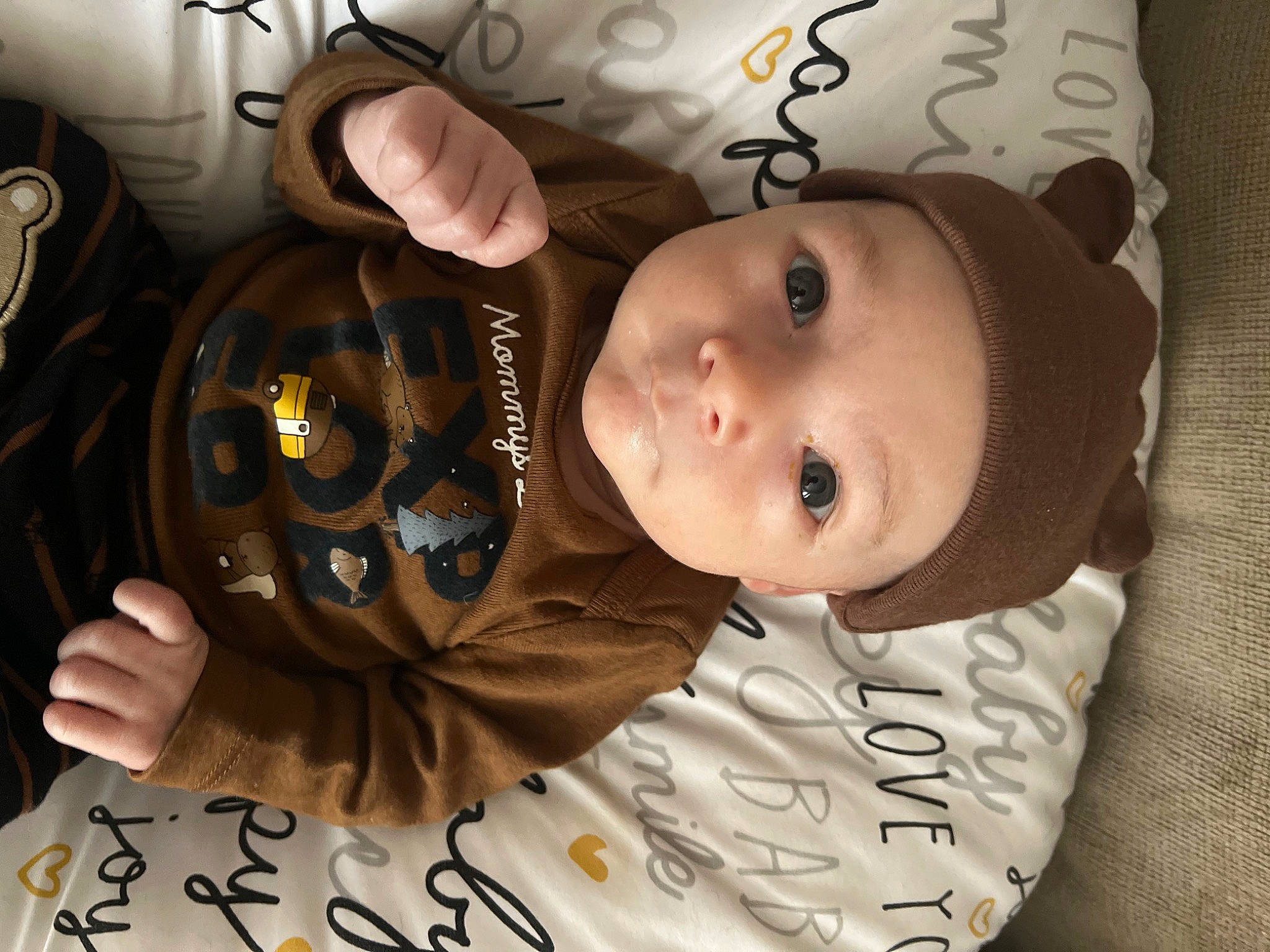 Beau is registered to the contest to win money with this photo: baby, baby_toddler_clothing, cheek, child, comfort, cool, eye, eyelash, flash_photography, happy, headwear, human, mammal, mouth, person, product, skin, sleeve, smile, textile