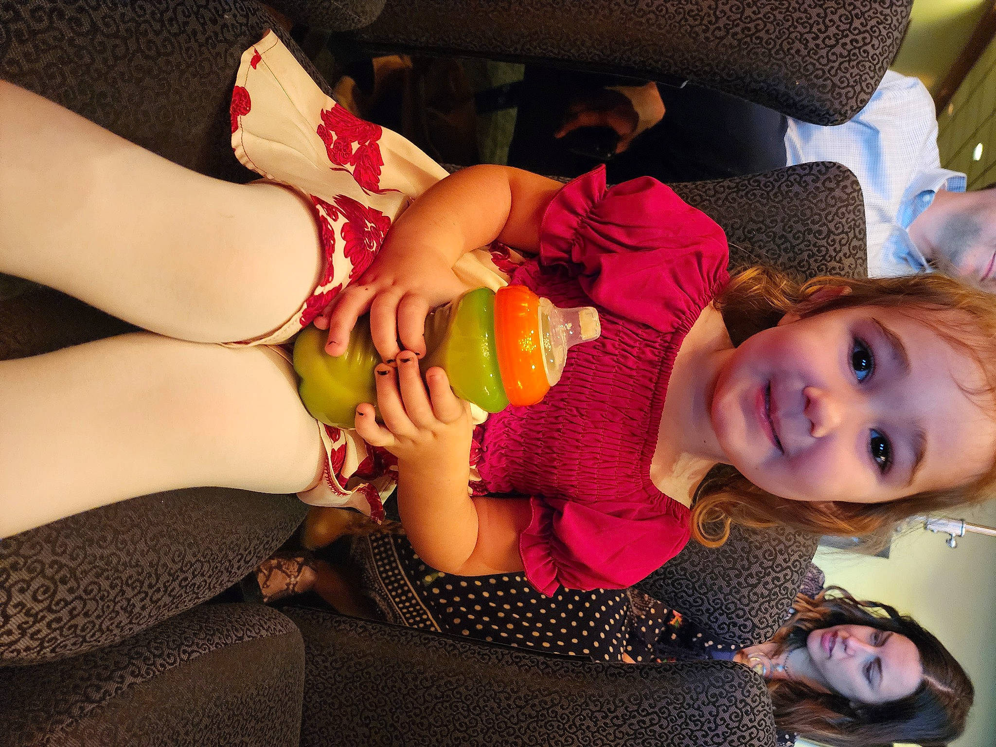 Fallon is registered to the contest to win money with this photo: baby_toddler_clothing, child, comfort, elbow, finger, fun, gesture, happy, human_body, human_leg, joy, knee, mouth, nail, person, skin, smile, thigh, thumb, toddler