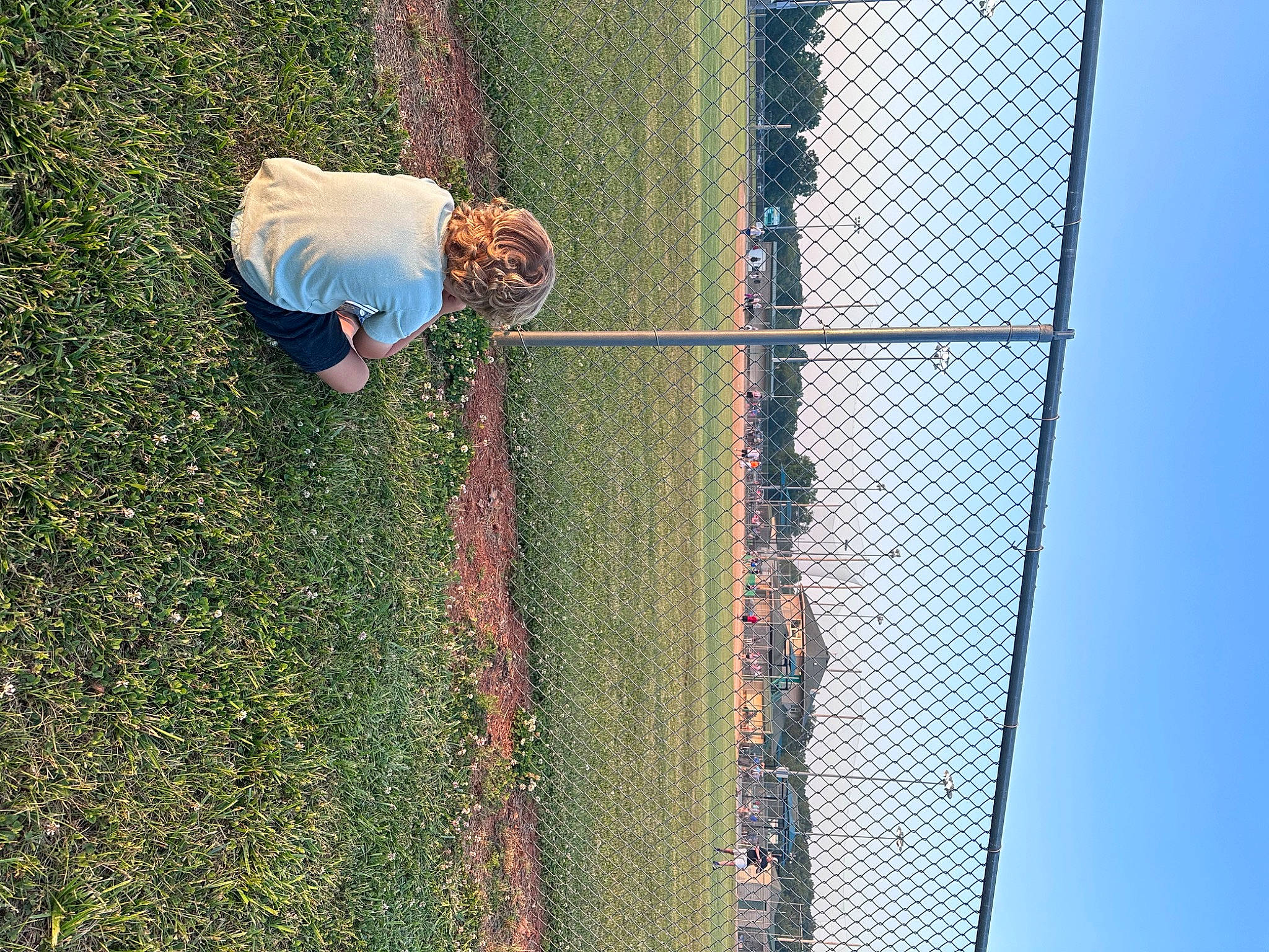 Grayson joined the competition — help win amazing prizes! chain_link_fencing, fun, grass, landscape, leisure, mesh, net, pattern, people_in_nature, person, plant, recreation, reflection, shadow, sky, soil, toddler, wire_fencing