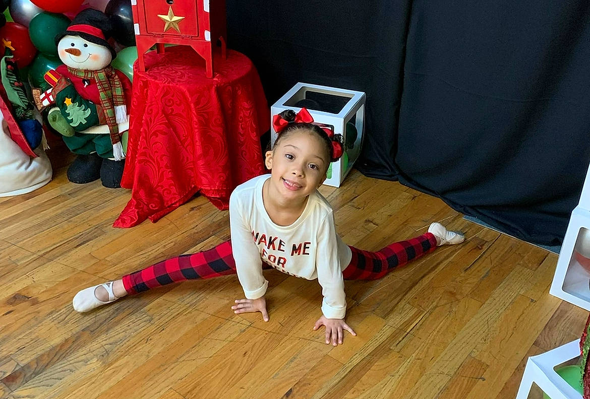 Nylah is registered to the contest to win money with this photo: baby_toddler_clothing, child, event, floor, flooring, foot, fun, happy, hardwood, human_leg, joy, laminate_flooring, leisure, person, smile, t_shirt, thigh, toddler, varnish, wood