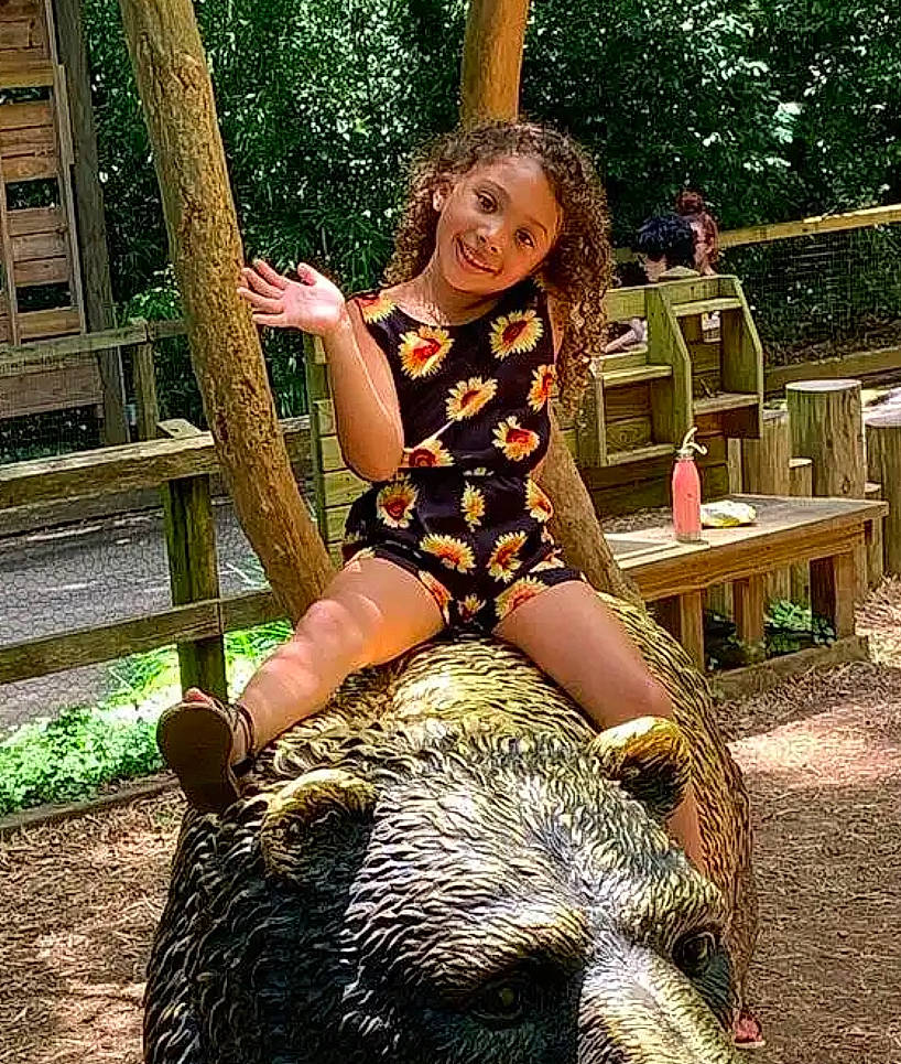 Nylah joined the competition — help win amazing prizes! boot, fawn, fun, fur, garden, grass, human_leg, joy, landscape, leisure, pattern, people_in_nature, person, plant, recreation, sitting, soil, terrestrial_animal, thigh, toddler