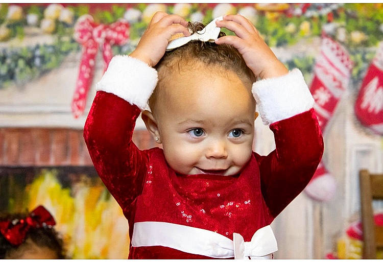 Nalani is registered to the contest to win money with this photo: baby, baby_toddler_clothing, child, christmas, christmas_decoration, christmas_eve, christmas_ornament, event, facial_expression, fun, happy, holiday, laugh, ornament, person, portrait_photography, red, sleeve, smile, toddler