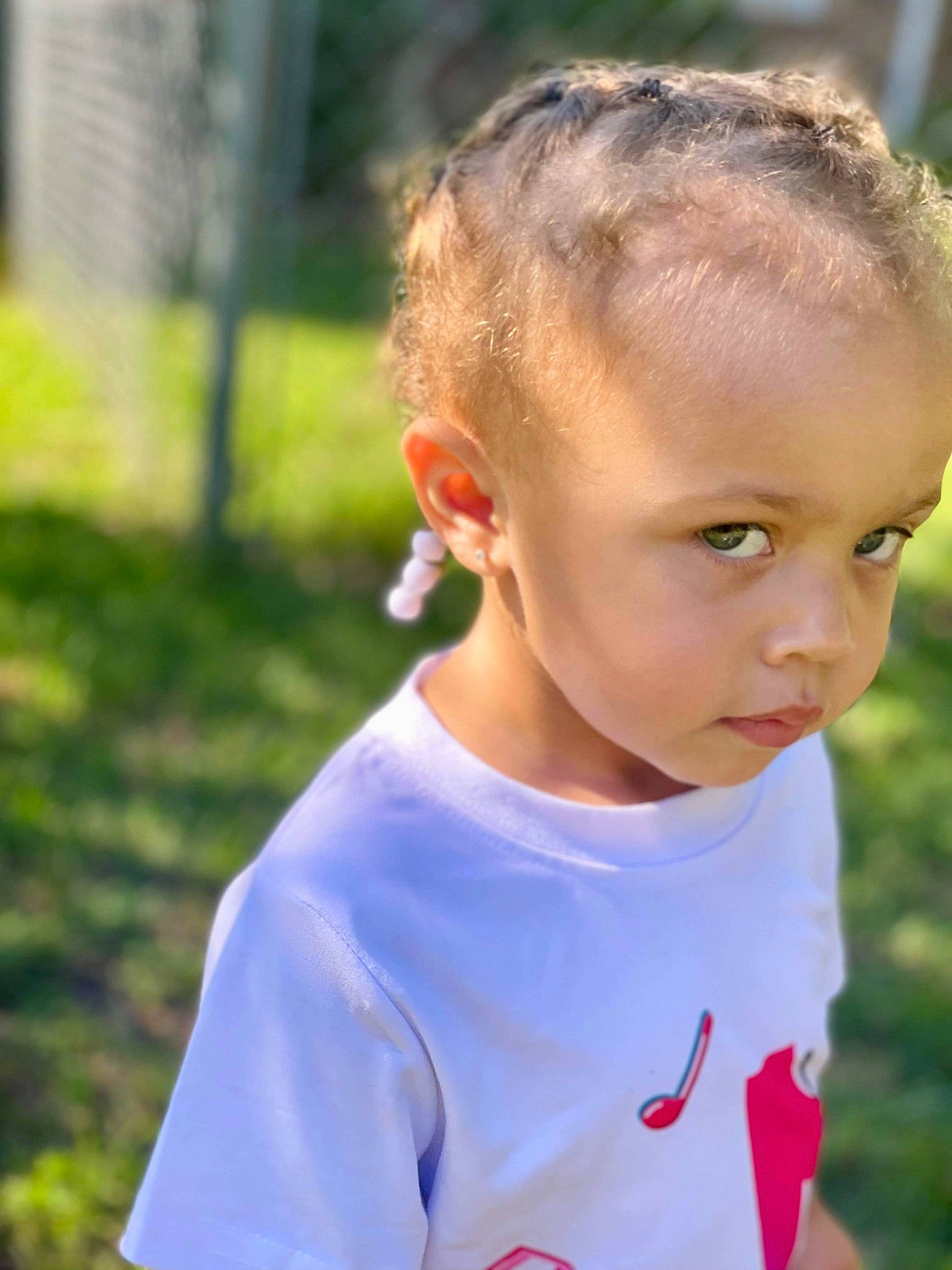 Nalani joined the competition — help win amazing prizes! buzz_cut, child, child_model, ear, electric_blue, fun, grass, grassland, happy, leisure, neck, nose, people_in_nature, person, play, portrait_photography, recreation, sleeve, t_shirt, toddler