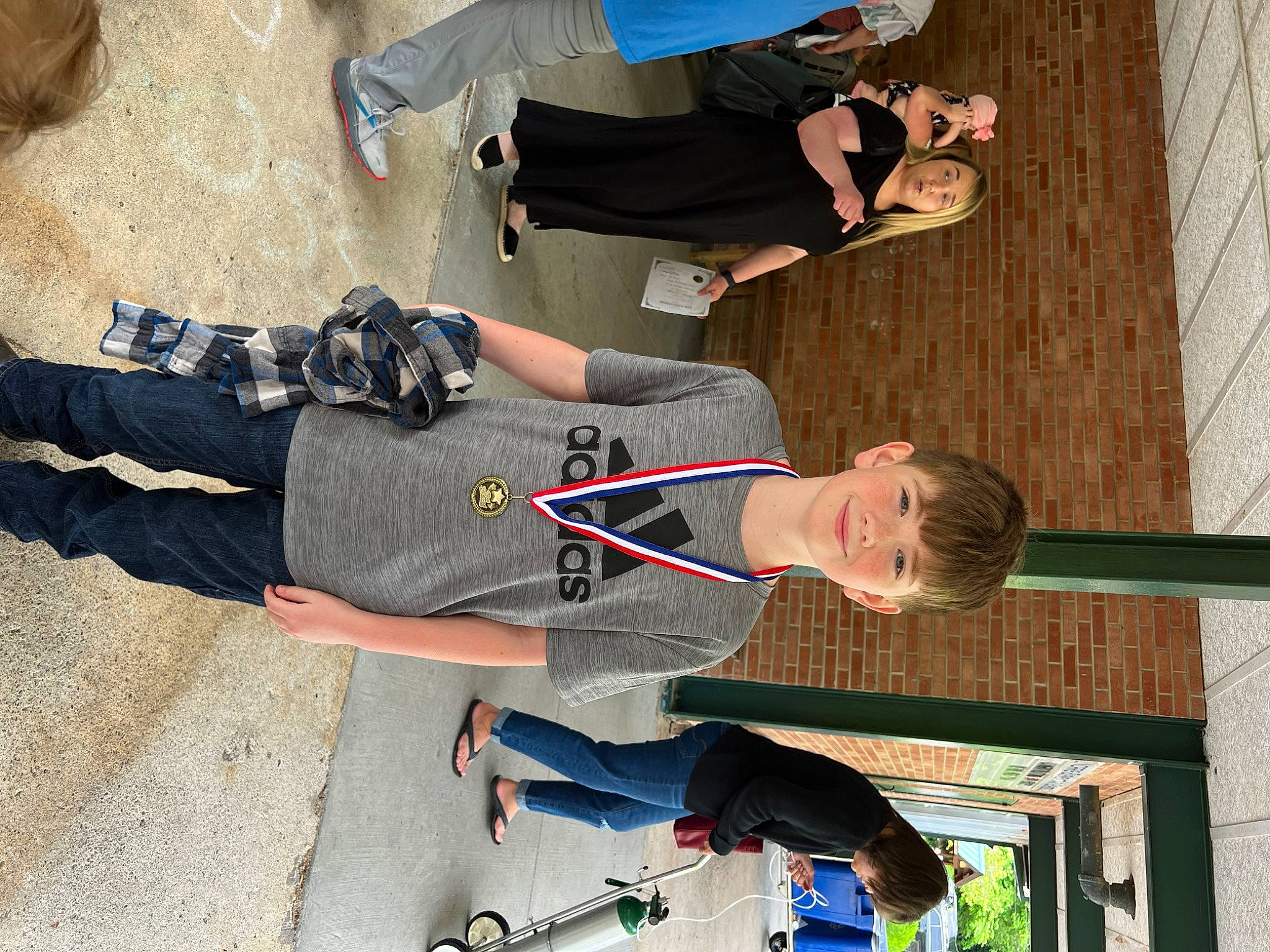 Jayden is registered to the contest to win money with this photo: elbow, fun, gesture, hat, joy, leisure, outdoor_shoe, person, photograph, recreation, shoe, smile, sneakers, t_shirt, thigh, walking_shoe, wrist