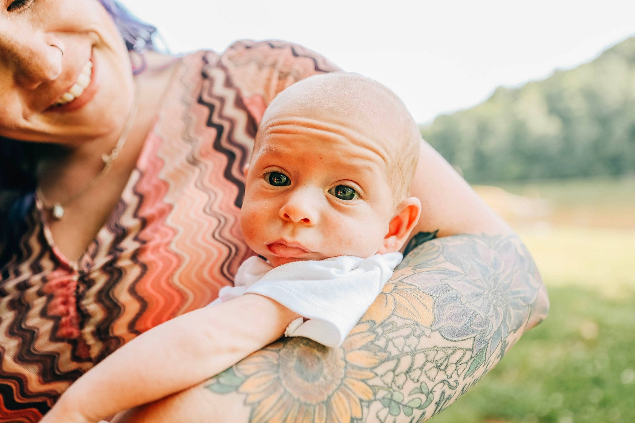 Dawson is registered to the contest to win money with this photo: baby, baby_toddler_clothing, child, comfort, event, face, flash_photography, fun, gesture, grass, happy, hat, interaction, leisure, people_in_nature, person, portrait_photography, sitting, skin, toddler