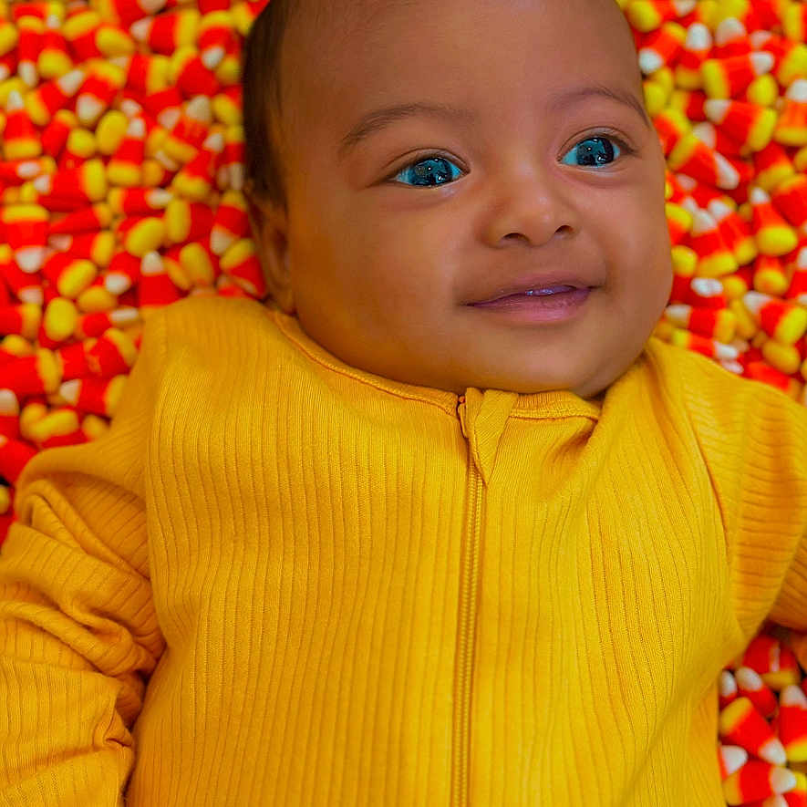 Dayron joined the competition — help win amazing prizes! baby, bodypart, candy, clothing, face, finger, food, hand, happy, head, knitwear, mouth, newborn, person, photography, portrait, smile, sweater, sweets, teeth