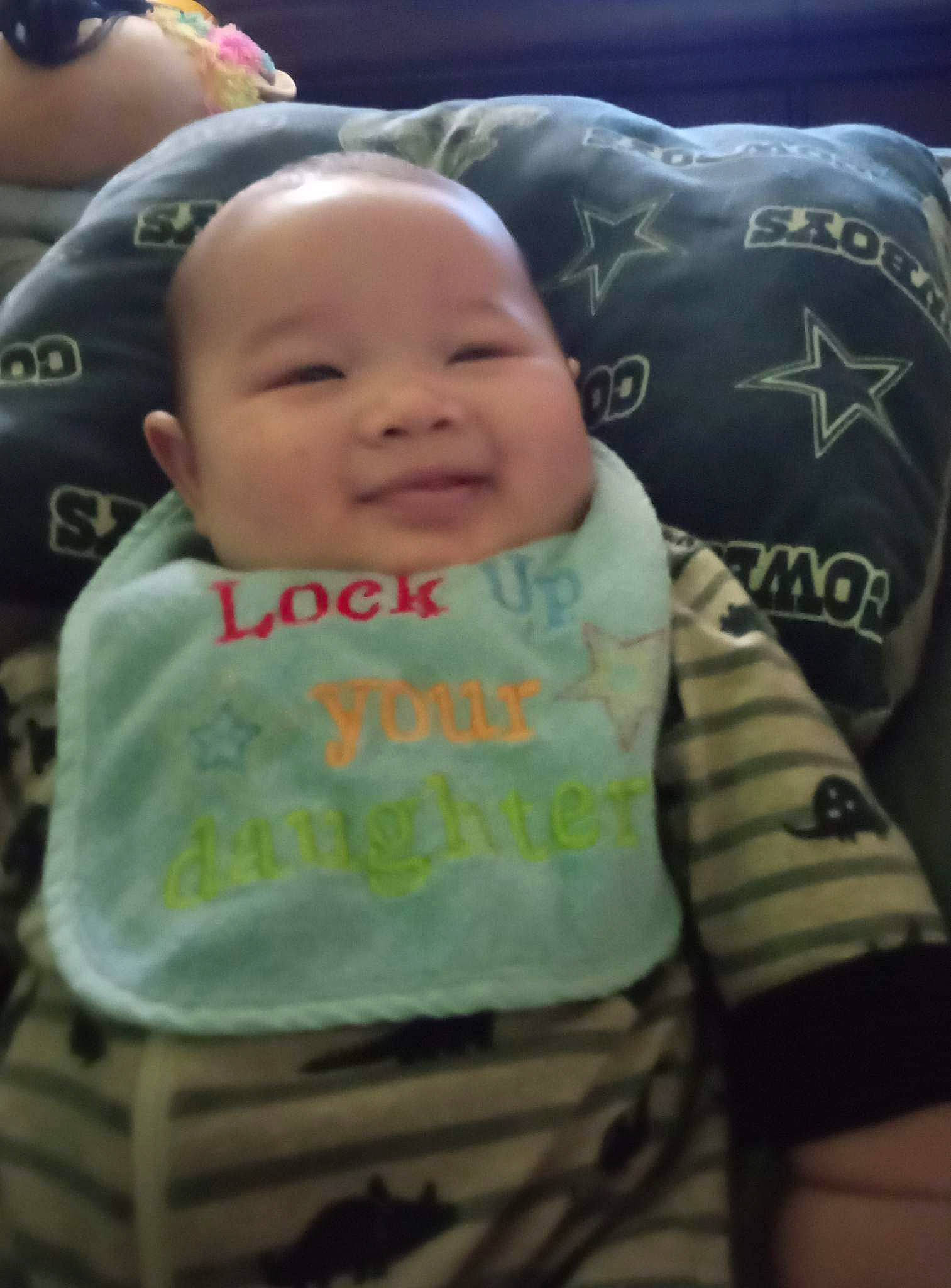 Antonio joined the competition — help win amazing prizes! baby, baby_carriage, baby_products, baby_toddler_clothing, bedding, cheek, child, comfort, eyebrow, fun, happy, linens, person, photo_caption, room, sitting, sleeve, smile, t_shirt, textile