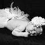 Dolcie joined the competition — help win amazing prizes! adorable, baby, black_and_white, child, closeup, cute, face, flower, hands, headband, infant, newborn, peaceful, portrait, resting, skin, sleeping, soft, studio, tutu