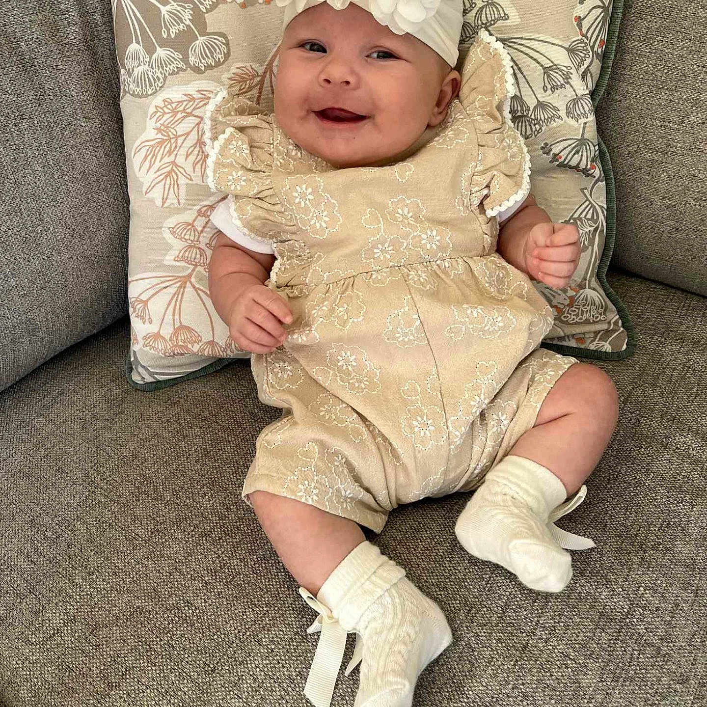 Dolcie joined the competition — help win amazing prizes! baby, child, clothing, comfort, couch, cushion, cute, decor, fabric, happy, headband, indoor, infant, person, portrait, relaxed, seat, smiling, socks, soft