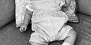 Dolcie is registered to the contest to win money with this photo: baby, black_and_white, child, clothing, comfort, couch, cushion, cute, fabric, floral_pattern, happy, headband, indoors, infant, portrait, seated, small_person, smiling, socks, texture