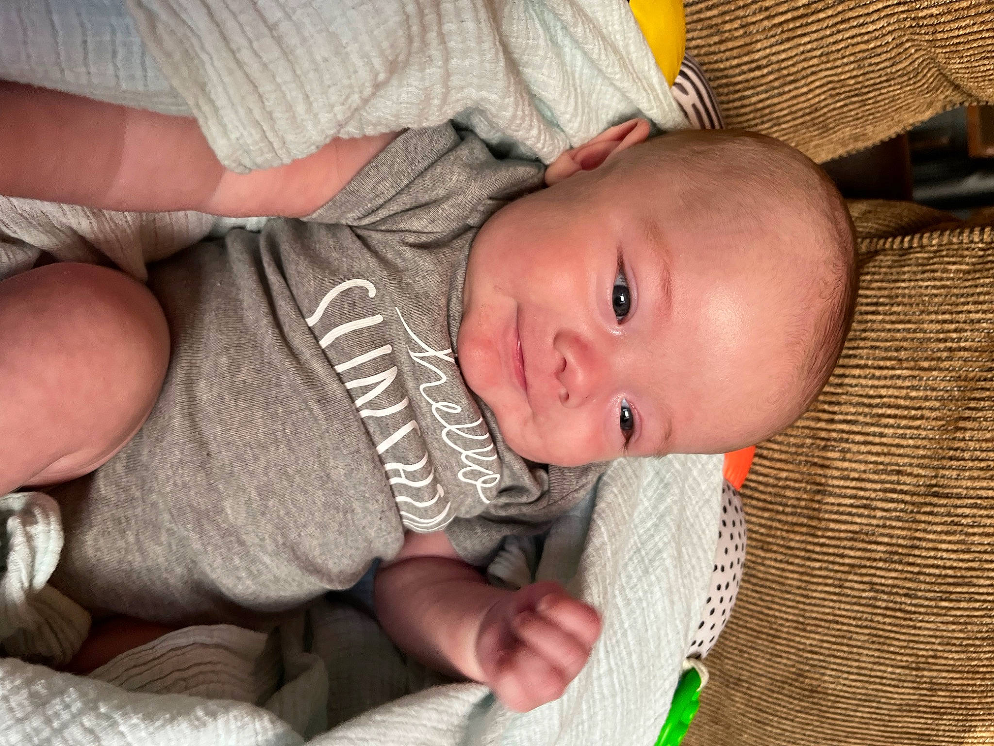 Leo joined the competition — help win amazing prizes! baby, baby_products, baby_toddler_clothing, cheek, child, comfort, eye, face, finger, infant_bed, iris, linens, nail, nose, pattern, person, skin, smile, thumb, toddler