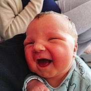Nolan participe au concours pour gagner de l'argent avec cette photo : baby, smiling, infant, face, hand, clothing, person, happy, newborn, closeup, skin, cute, portrait, young_child, sleeve, warm, comfort, joy, expression, indoor