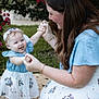 Charlotte joined the competition — help win amazing prizes! toddler, woman, child, outdoor, grass, flowers, dress, headband, holding_hands, smiling, happy, playful, nature, greenery, barefoot, mat, family, interaction, portrait, daylight