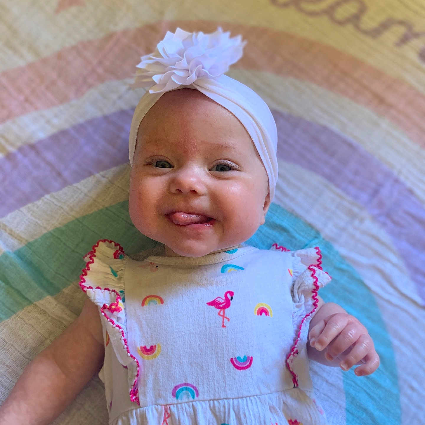 Lilith is registered to the contest to win money with this photo: accessories, baby, bodypart, bonnet, cap, clothing, dress, face, finger, hand, happy, hat, head, headband, newborn, person, photography, portrait, quilt, smile