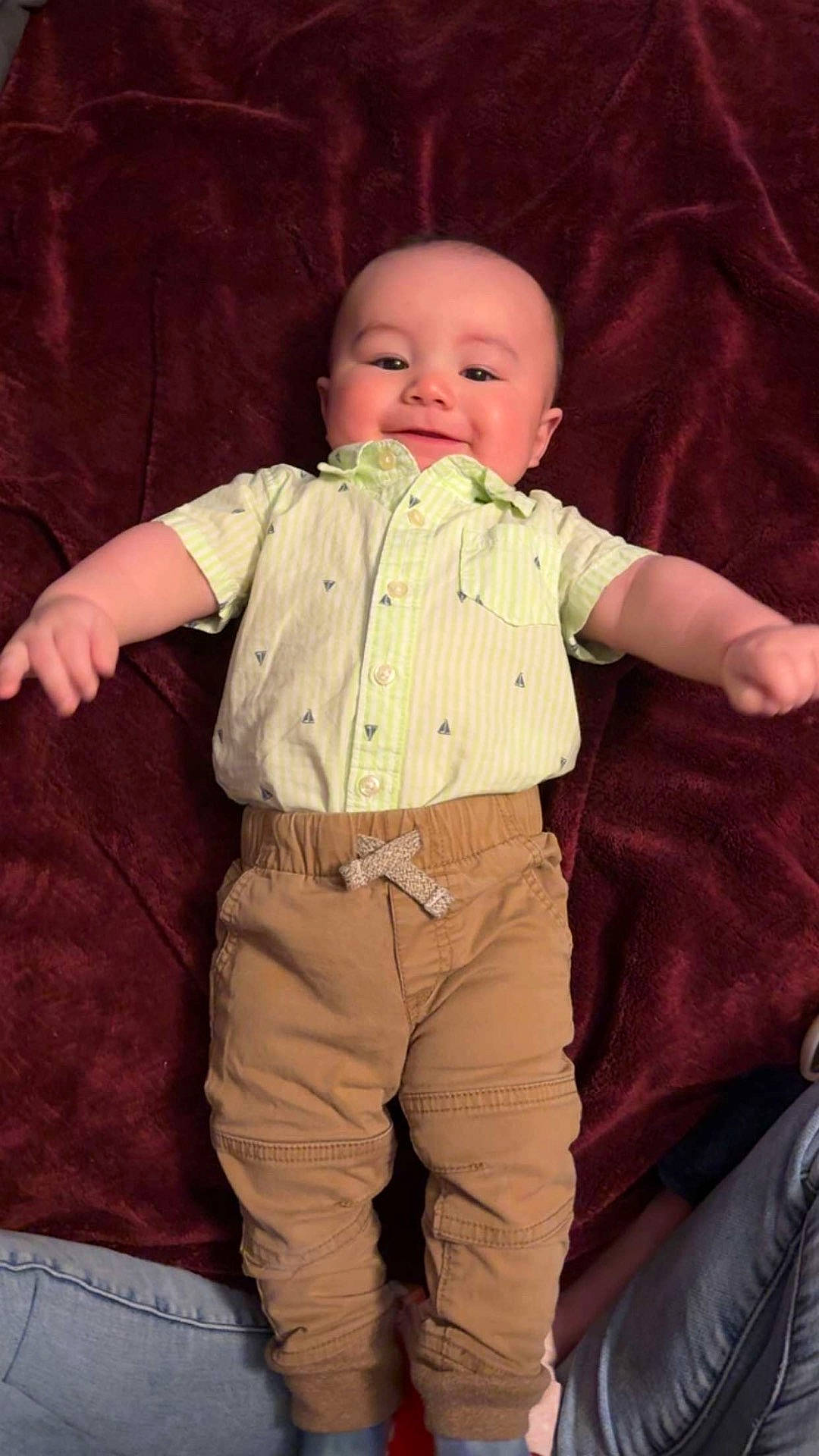baby, blanket, casual, child, clothing, cozy, cute, fabric, happy, indoor, infant, lying_down, pants, person, portrait, relaxed, shirt, smiling, soft, toddler