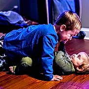 Julie joined the competition — help win amazing prizes! child, children, playing, indoor, floor, smiling, happy, boy, girl, clothing, sweater, pajamas, toy, home, wooden_floor, family, fun, interaction, cute, toddler