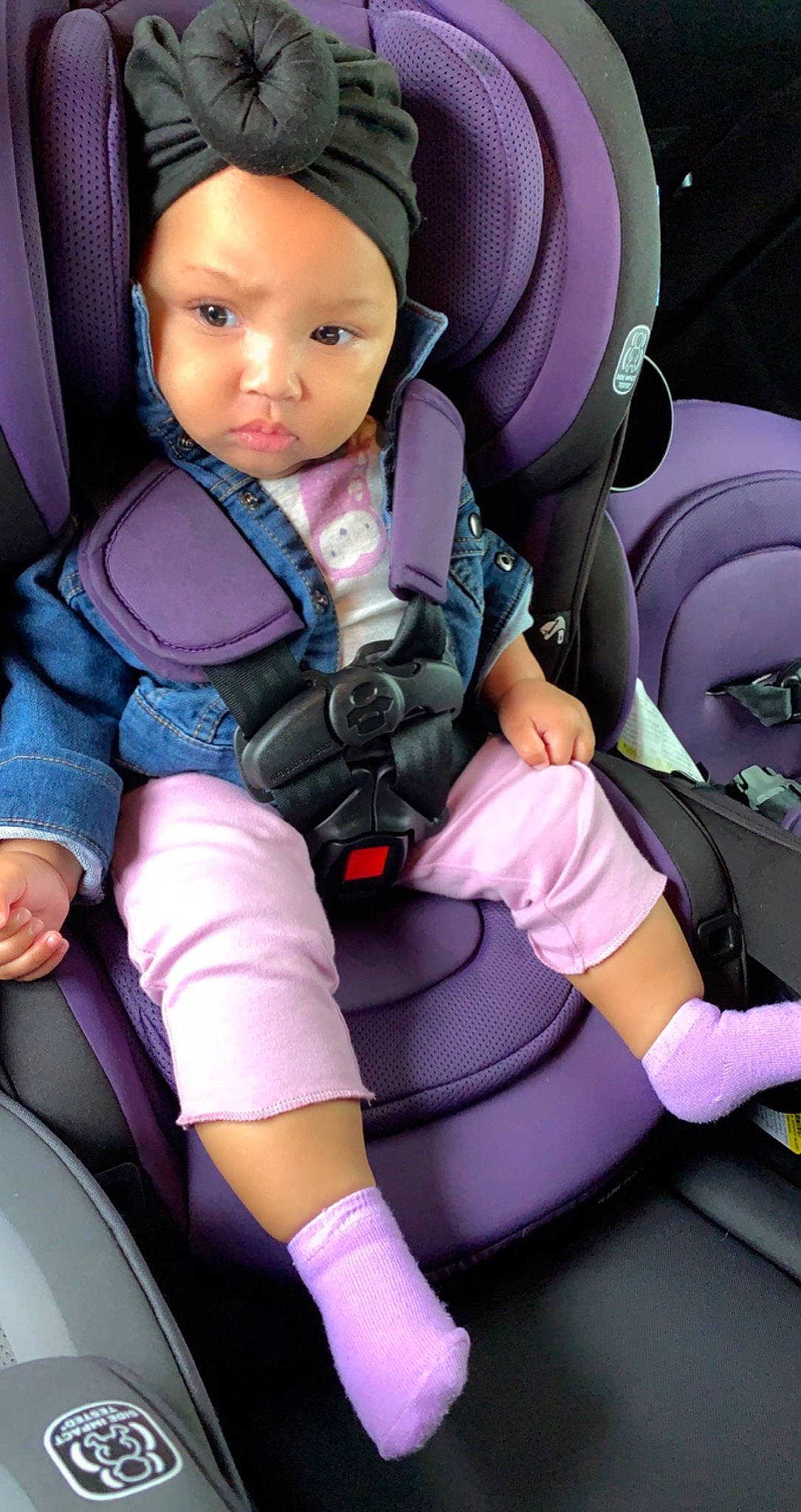 Brailyn is registered to the contest to win money with this photo: auto_part, baby, baby_carriage, baby_products, baby_toddler_clothing, beauty, car_seat, car_seat_cover, child, comfort, head_restraint, headwear, human_leg, knee, person, product, purple, seat_belt, thigh, toddler