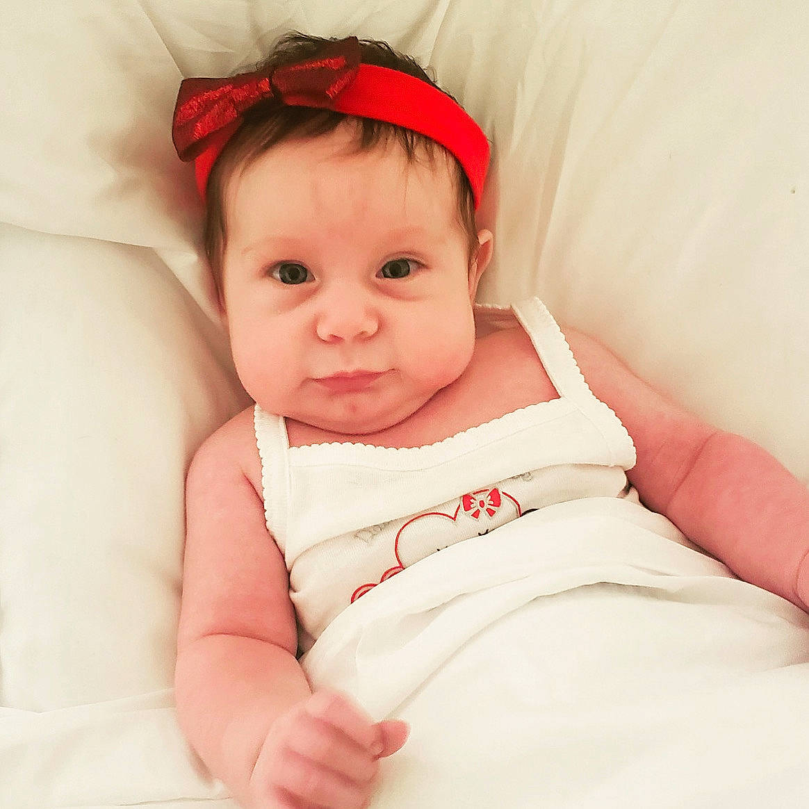 Lennox is registered to the contest to win money with this photo: baby, baby_products, baby_sleeping, baby_toddler_clothing, cheek, child, hair_accessory, head, headband, headgear, linens, lip, person, pink, product, skin, toddler, white