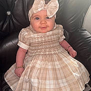 Talia-Louise joined the competition — help win amazing prizes! accessories, baby, bracelet, chair, child, cute, dress, fashion, happy, headband, indoor, leather, pattern, person, plaid, portrait, sitting, smiling, toddler, young