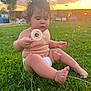 child, toddler, grass, dandelion, sunset, outdoor, barefoot, nature, curly_hair, diaper, greenery, fence, sky, clouds, sunlight, playing, caucasian, summer, baby, portrait
