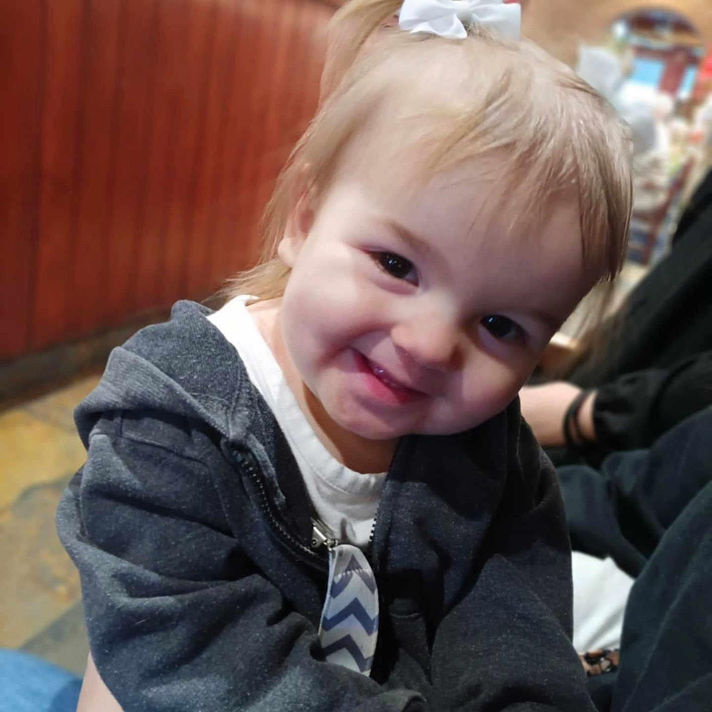 Madaline is registered to the contest to win money with this photo: baby, blazer, bodypart, city, clothing, coat, face, happy, head, jacket, mouth, pants, person, photography, portrait, road, smile, street, teeth, urban