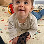 Leon participe au concours pour gagner de l'argent avec cette photo : baby, child, crawling, polka_dot, sock, play_mat, toy, basket, indoor, cute, dimples, curious, happy, clothing, floor, person, head, face, smiling, jeans