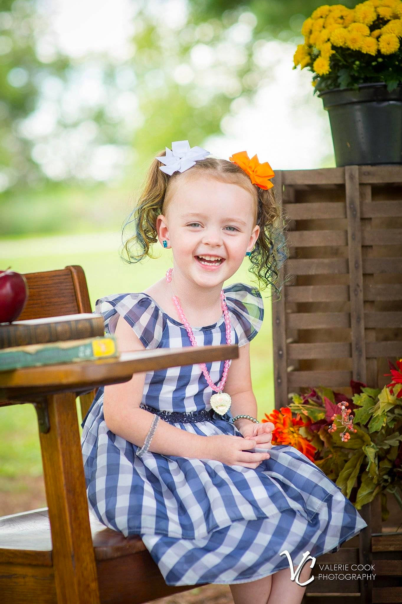 Sherry is registered to the contest to win money with this photo: baby_toddler_clothing, beauty, child, event, flower, flower_arranging, fun, grass, happy, joy, leaf, leisure, outdoor_furniture, person, photograph, plant, sitting, smile, snapshot, summer
