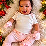 Serenity joined the competition — help win amazing prizes! baby, infant, smiling, christmas, holiday, decorations, ornaments, lights, white_rug, pink_clothing, mittens, happy, cute, festive, headband, indoor, portrait, celebration, child, seasonal