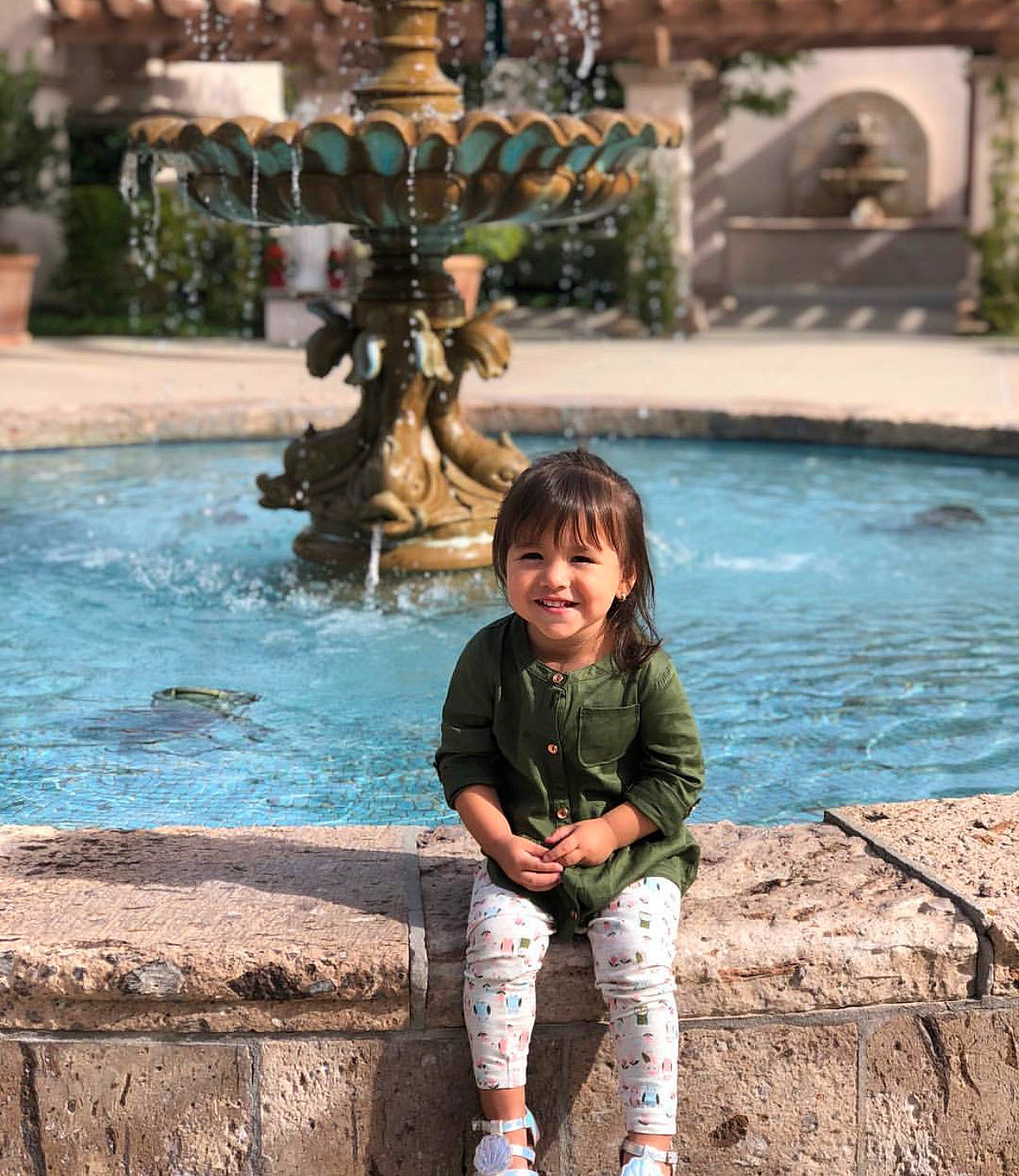 Jewel is registered to the contest to win money with this photo: child, fawn, fountain, fun, happy, joy, leisure, person, photography, plant, play, recreation, smile, tourism, travel, tree, vacation, water, water_feature