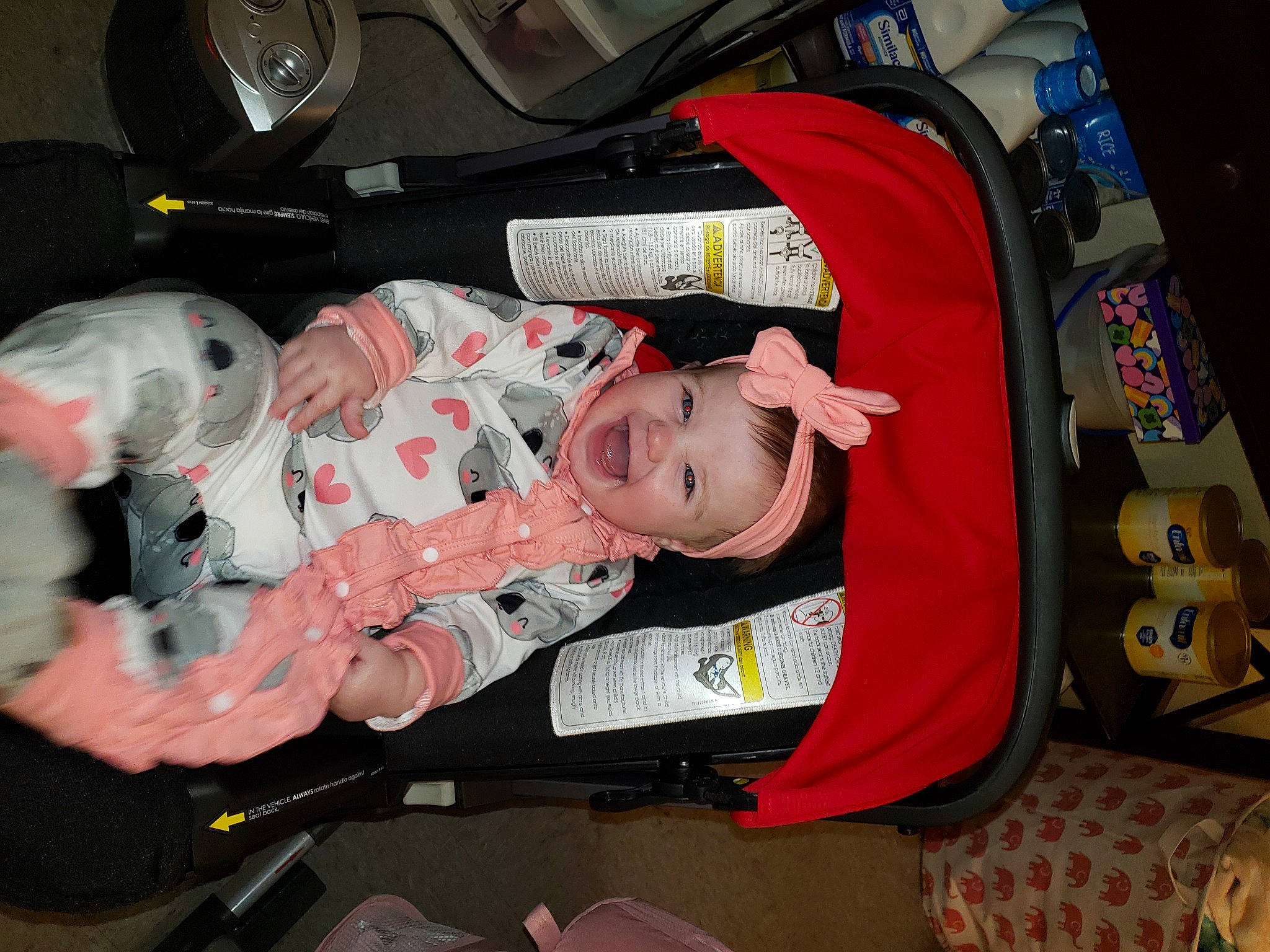 Emerson joined the competition — help win amazing prizes! baby, baby_carriage, baby_products, baby_toddler_clothing, bag, baggage, child, comfort, headwear, lap, luggage_and_bags, person, product, room, suitcase, textile, toddler