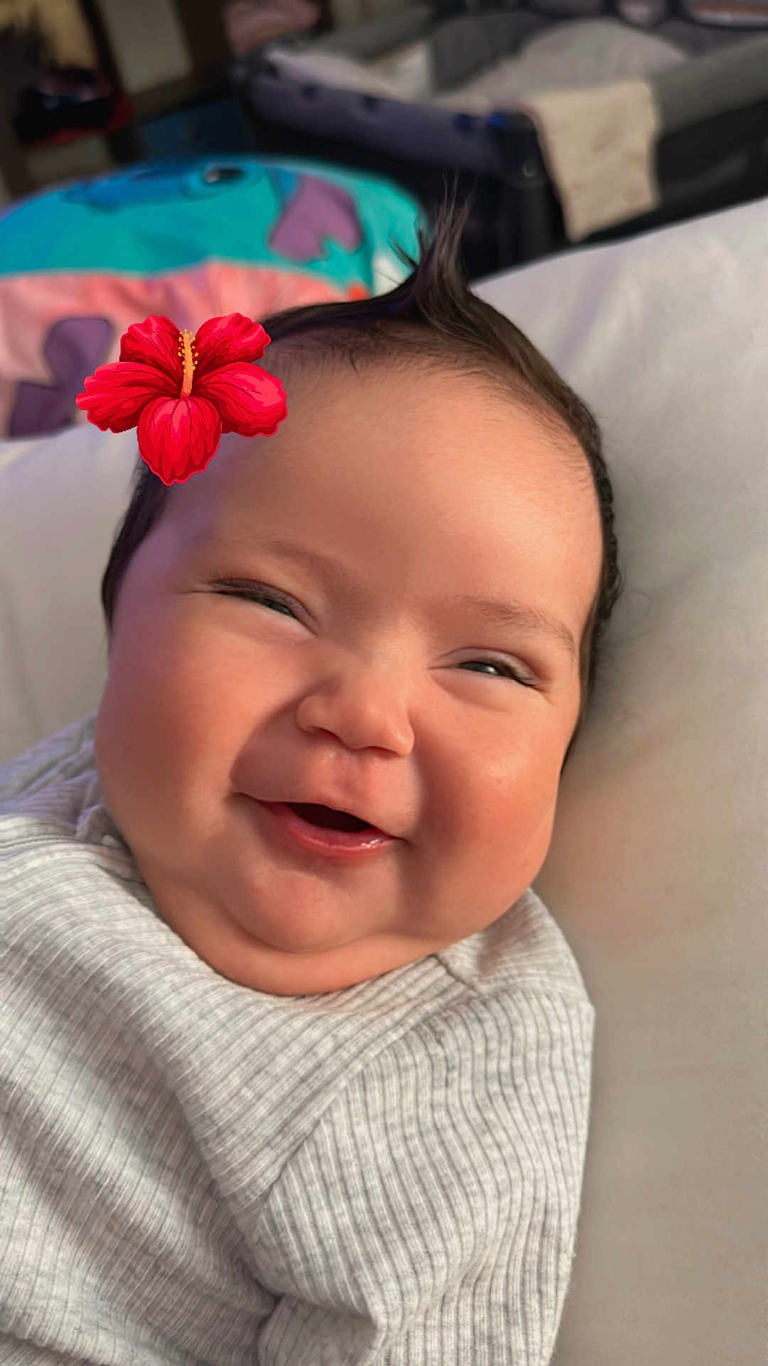 Kalia-Love is registered to the contest to win money with this photo: baby, smiling, face, flower, hair, infant, cute, portrait, happy, child, clothing, cozy, indoors, closeup, skin, cheeks, expression, toddler, head, cute_outfit