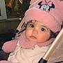baby, cartoon_character, child, child_fashion, closeup, cute, face, hat, infant, mickey_mouse, outdoor, person, pink, portrait, scarf, stroller, warm_clothing, wide_eyes, winter_clothing, young_child
