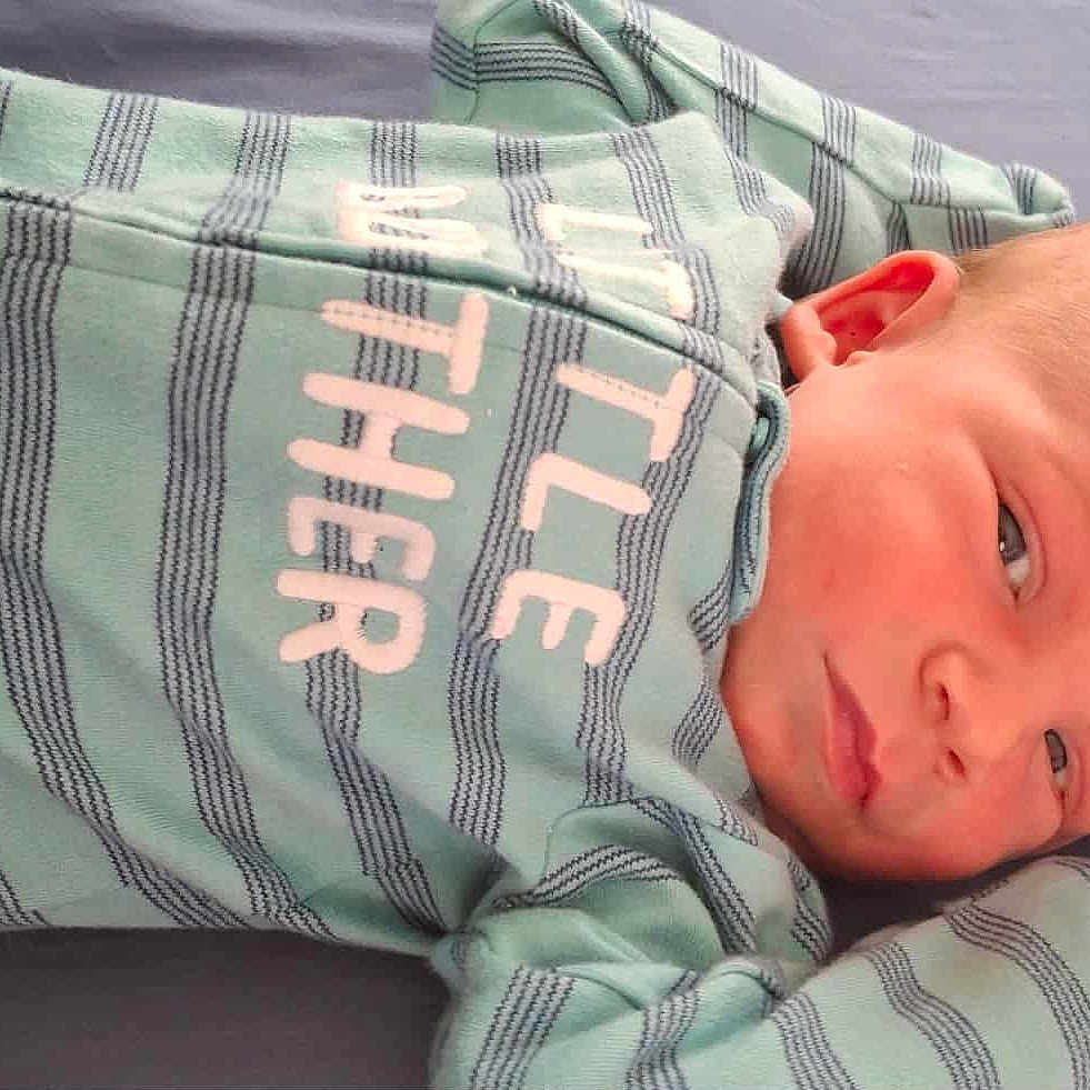 Izaak is registered to the contest to win money with this photo: baby, bed, blanket, clothing, cushion, face, furniture, head, homedecor, knitwear, newborn, pajamas, person, photography, portrait, shirt, sleeping, sweater, sweatshirt, t_shirt