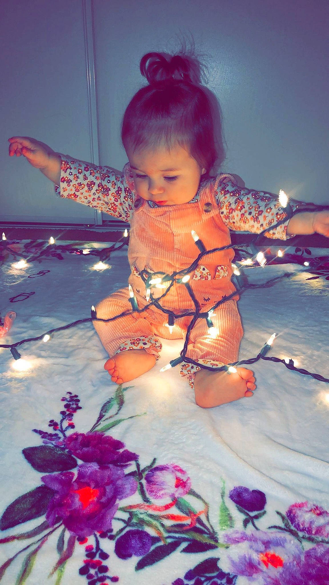 Marlee is registered to the contest to win money with this photo: abdomen, baby, barefoot, beauty, child, flash_photography, foot, fun, happy, human_leg, magenta, orange, person, petal, pink, purple, sitting, sky, thigh, toddler