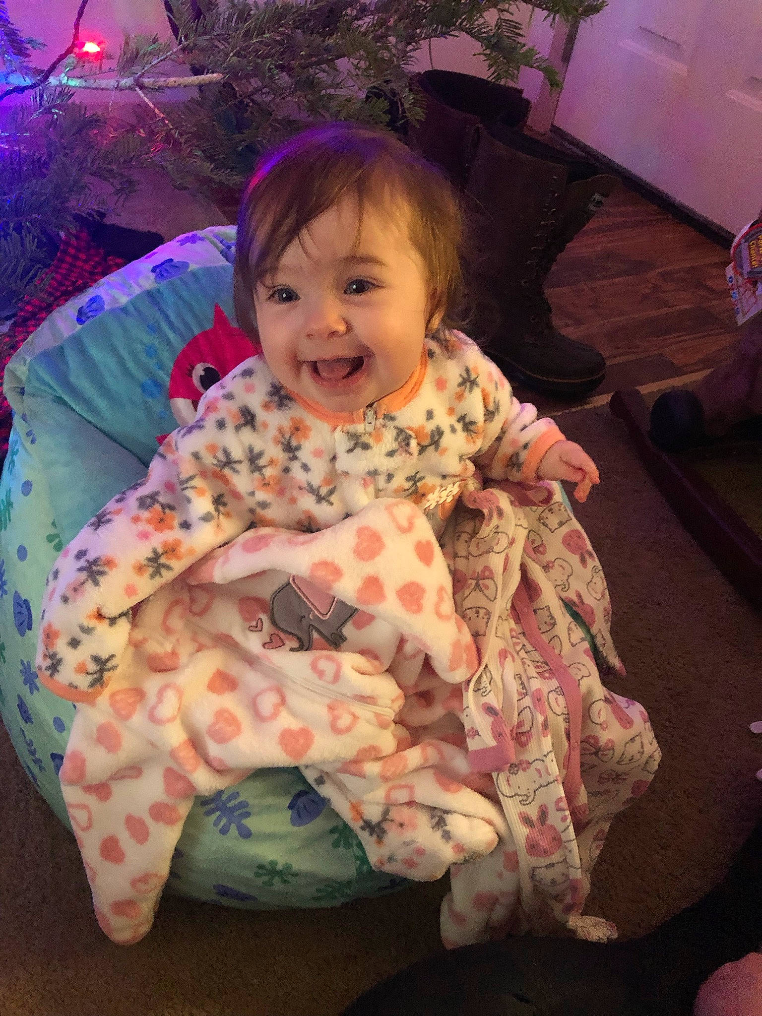 Marlee is registered to the contest to win money with this photo: baby, baby_toddler_clothing, cheek, comfort, eye, fun, hair, hairstyle, happy, head, human_body, iris, joy, magenta, person, pink, purple, skin, sleeve, smile