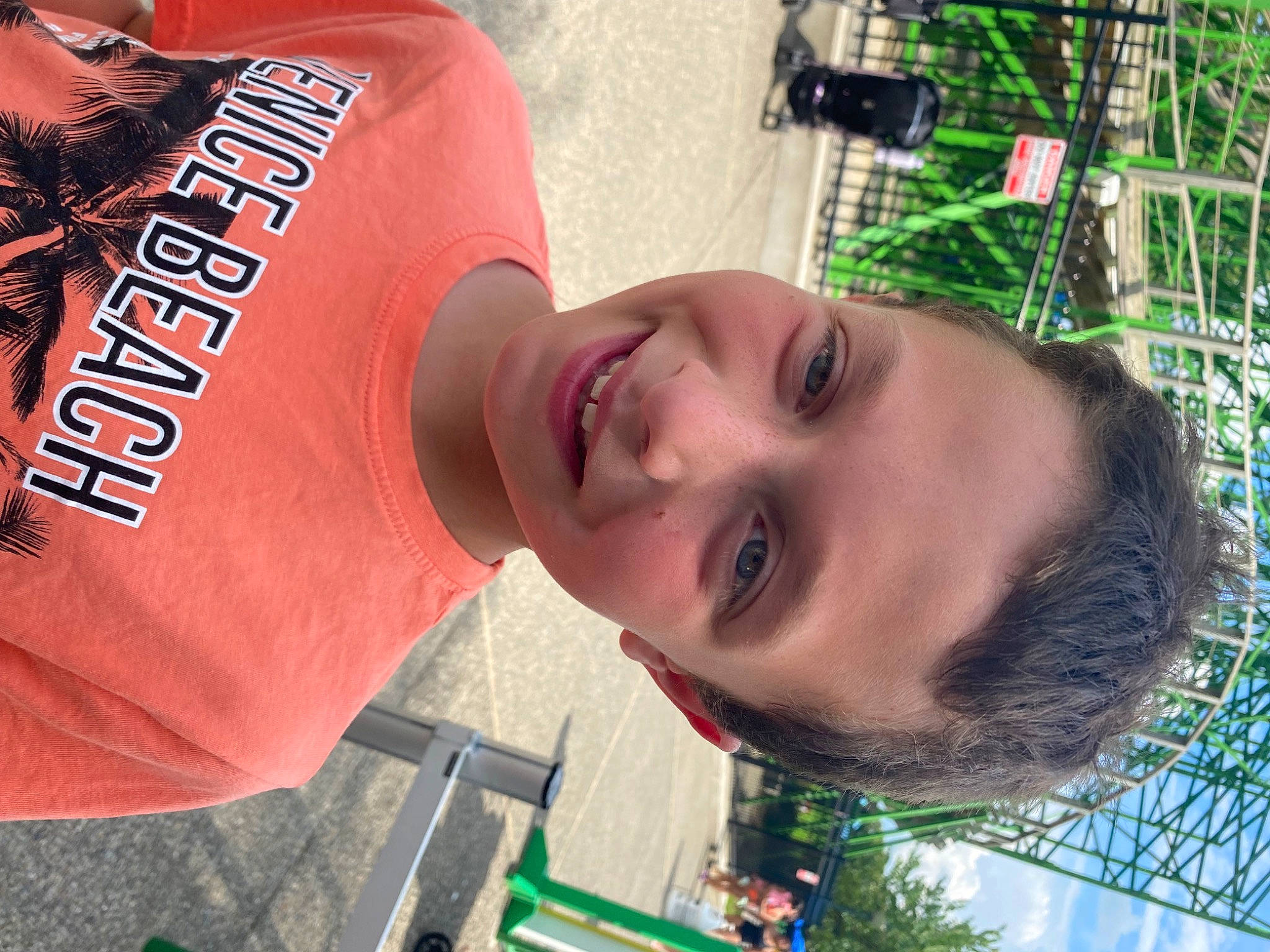 Conner Colon is registered to the contest to win money with this photo: black_hair, child, chin, cool, eyewear, facial_expression, forehead, fun, green, hairstyle, happy, hat, joy, leisure, lip, mouth, neck, person, recreation, sleeve