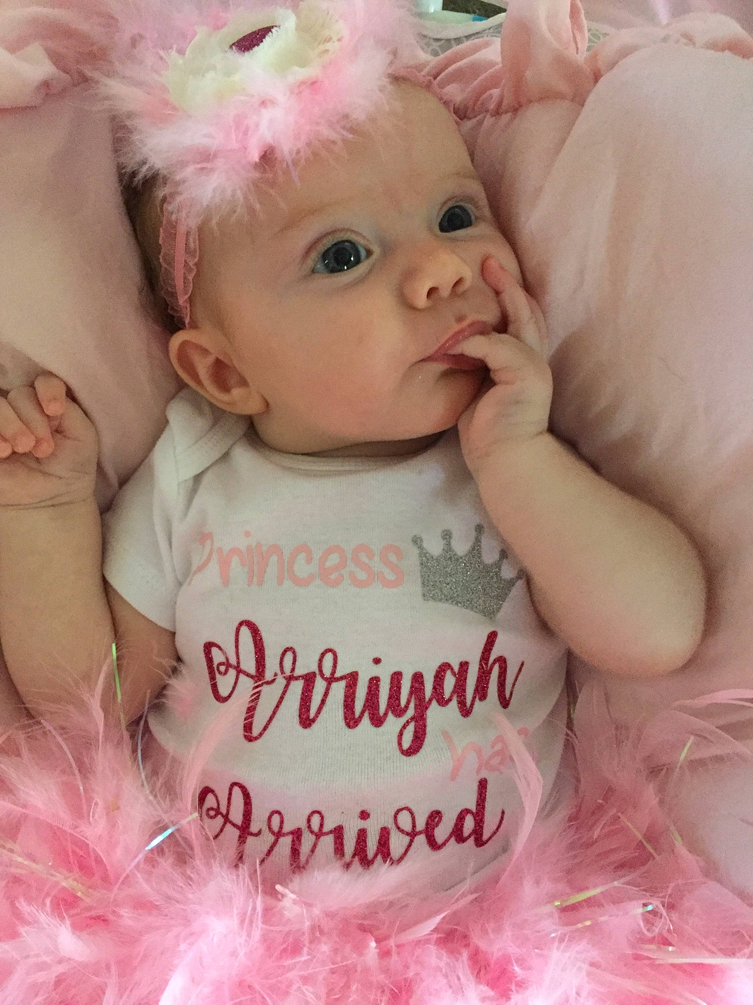 Arriyah is registered to the contest to win money with this photo: baby, baby_products, baby_toddler_clothing, cheek, child, costume, eye, face, fur, hair_accessory, head, headgear, iris, lip, person, photo_caption, photography, pink, product, skin