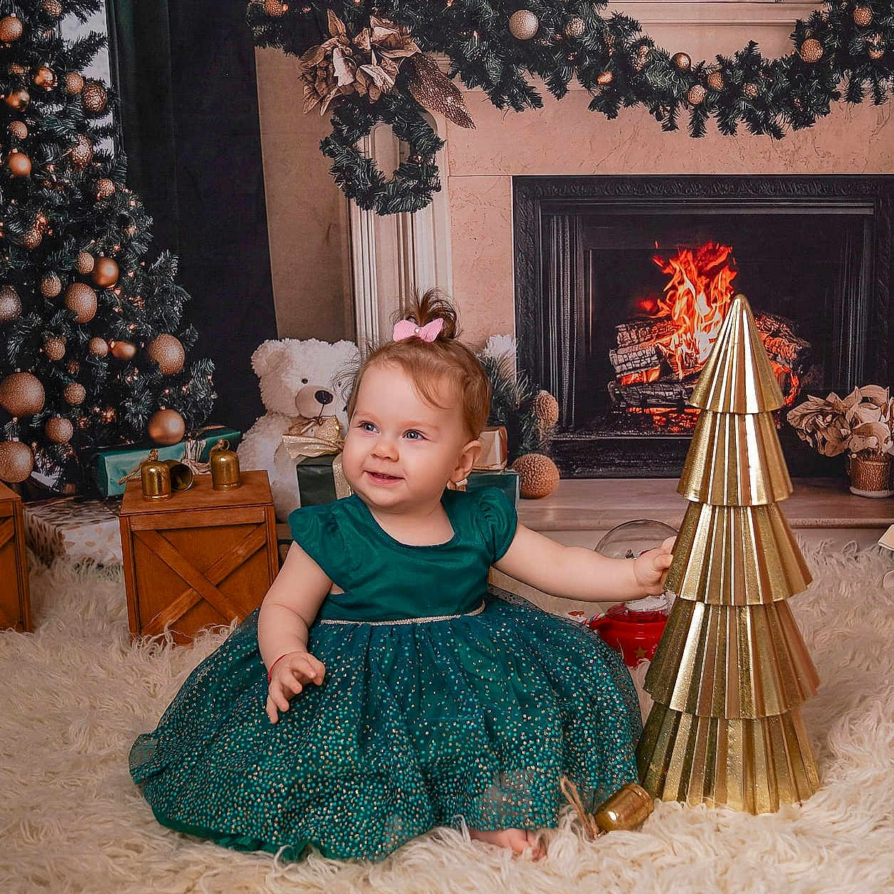 Iris is registered to the contest to win money with this photo: baby, carpet, celebration, child, christmas_decorations, christmas_tree, cute, dress, festive, fireplace, gift_boxes, golden_tree, green_dress, happy, holiday, indoors, portrait, sitting, smiling, teddy_bear