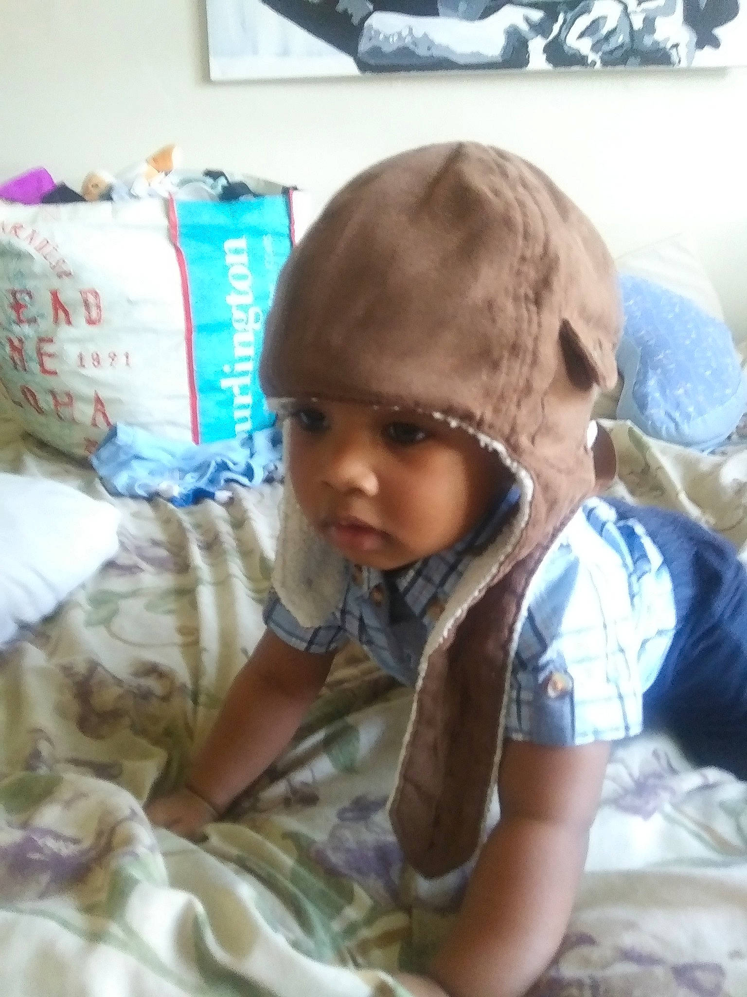 Kal-el is registered to the contest to win money with this photo: baby, child, cool, ear, face, forehead, head, headgear, person, skin, smile, toddler