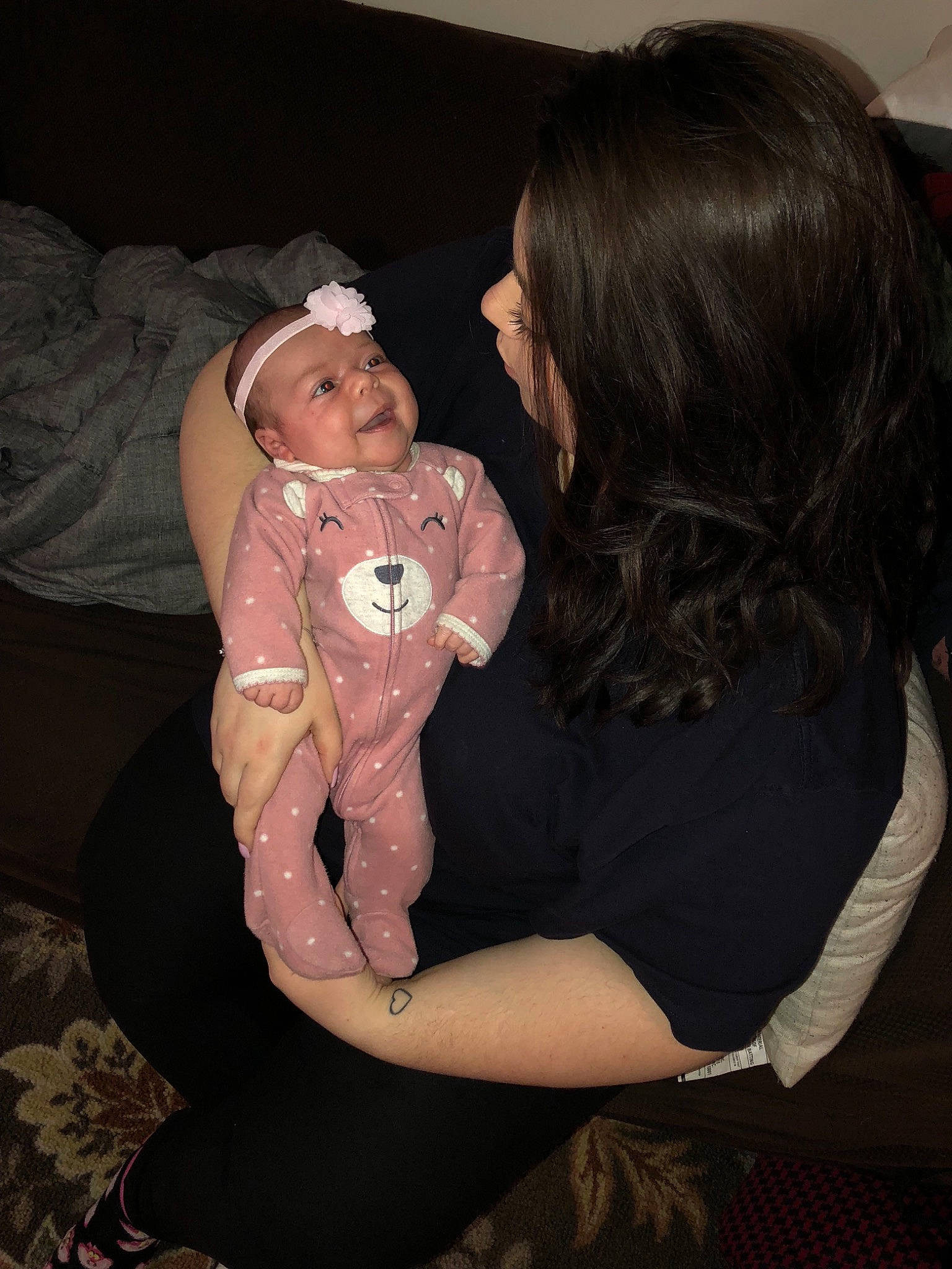 Flora is registered to the contest to win money with this photo: abdomen, arm, baby, child, daughter, fun, human_body, lap, leg, mother, muscle, party, person, sitting, smile, thigh, tights, toddler, trunk, vacation