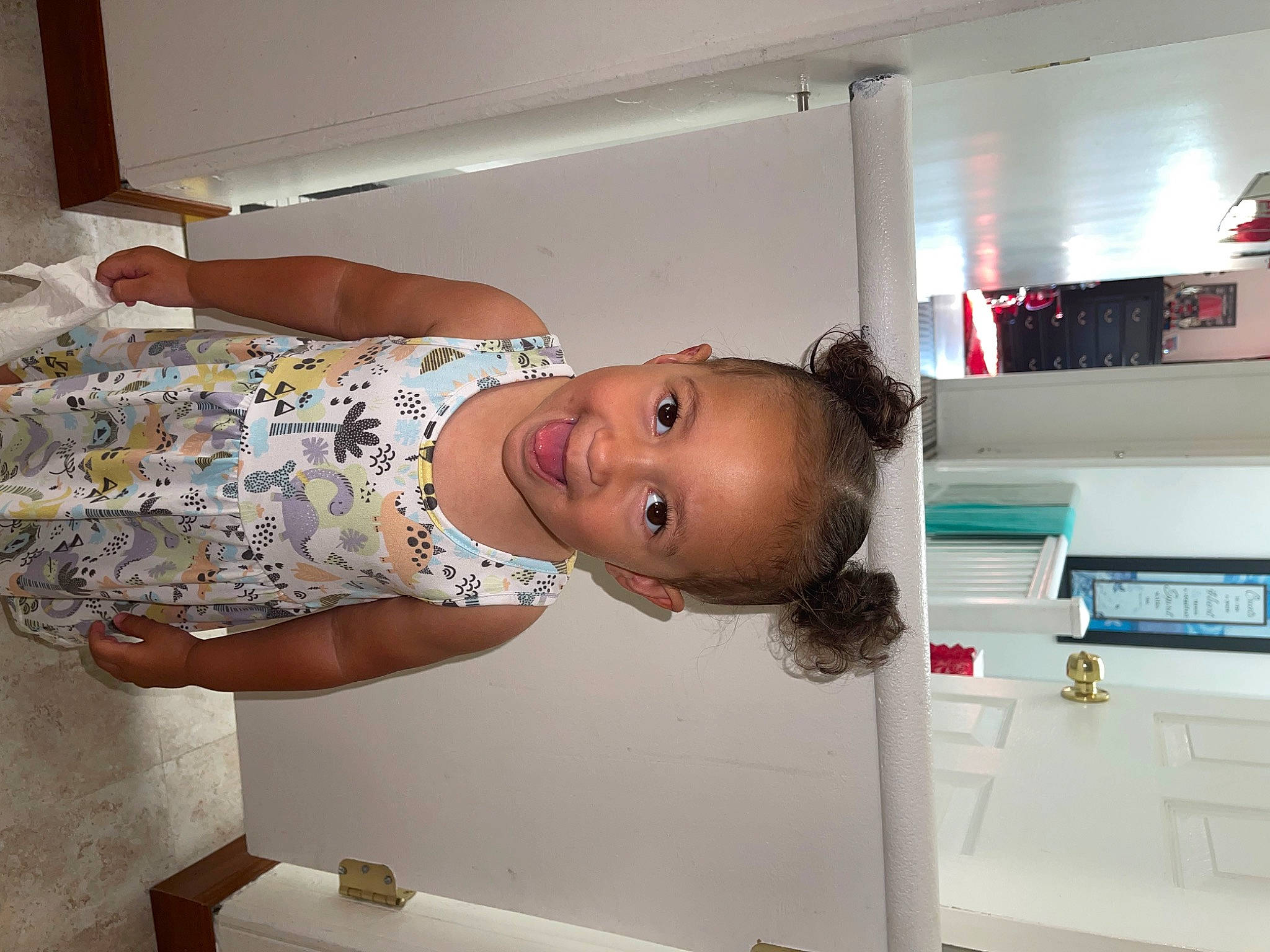 Adelynn is registered to the contest to win money with this photo: baby, bathing, child, flooring, home_appliance, homemaker, joy, kitchen, laundry_room, machine, major_appliance, office_equipment, office_supplies, person, photocopier, printer, refrigerator, room, smile, toddler