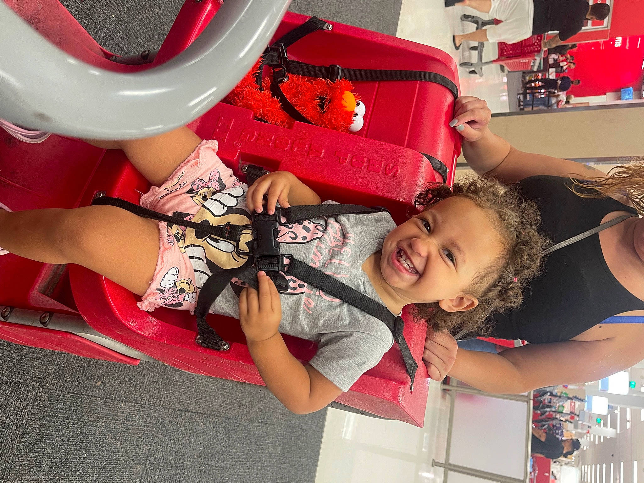 Adelynn is registered to the contest to win money with this photo: arm, automotive_design, bumper, carmine, child, fashion, fun, happy, human_leg, joy, leg, leisure, motor_vehicle, person, pink, recreation, red, smile, snapshot, thigh