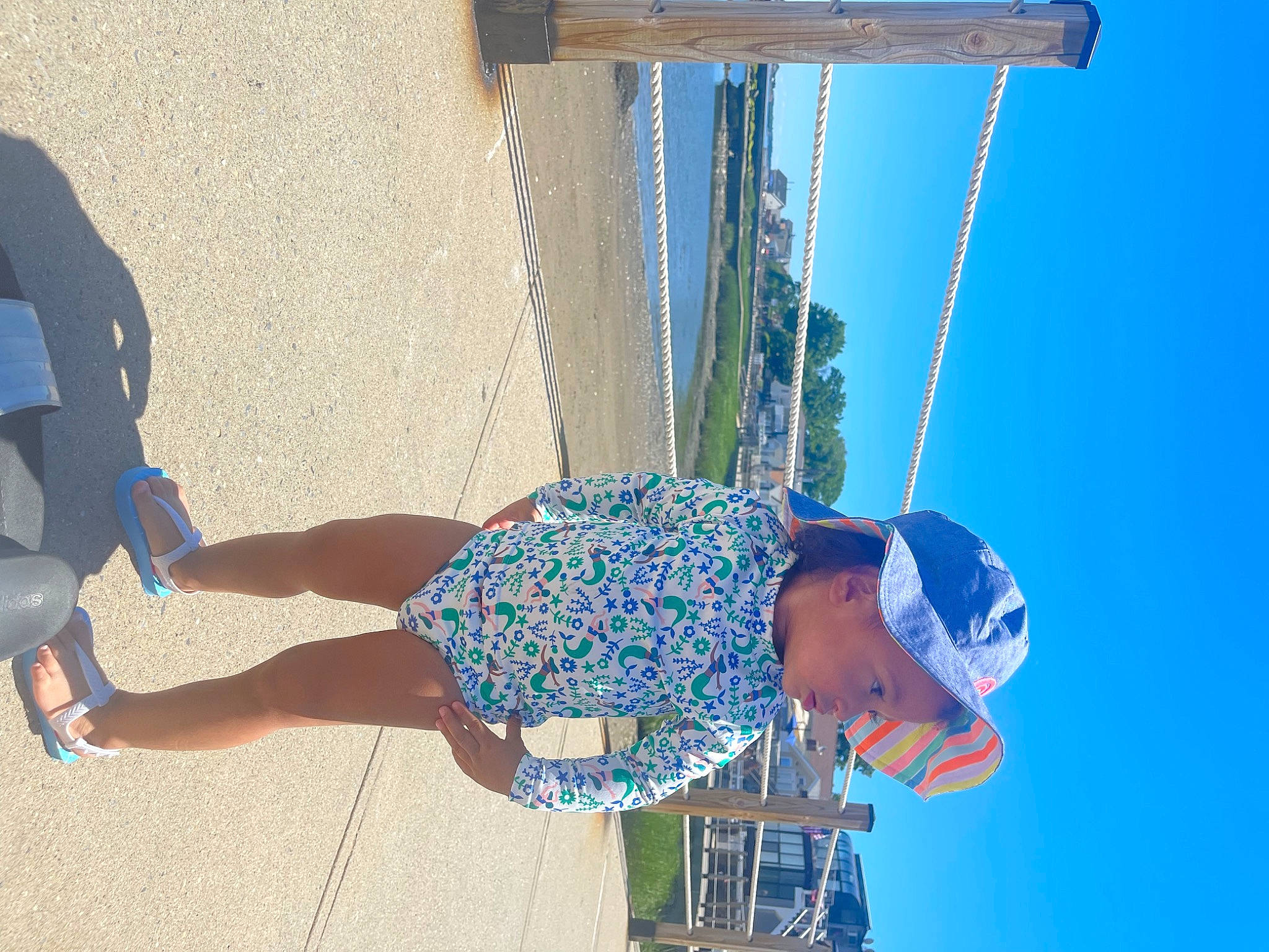 Adelynn joined the competition — help win amazing prizes! azure, beach, blue, calf, elbow, electric_blue, foot, fun, hat, headwear, human_leg, knee, landscape, leisure, person, recreation, shorts, sky, thigh, travel