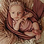 baby, infant, blanket, knitwear, headband, wrapped, sleepy, cozy, soft_texture, newborn, child, portrait, cute, warm_colors, hands, feet, resting, indoors, closeup, peaceful