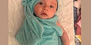 Fraeya joined the competition — help win amazing prizes! baby, infant, towel, blue_towel, blanket, bed, cute, face, eyes, headwear, child, soft_texture, wrapped, lying_down, indoors, newborn, expression, skin, hood, comfort
