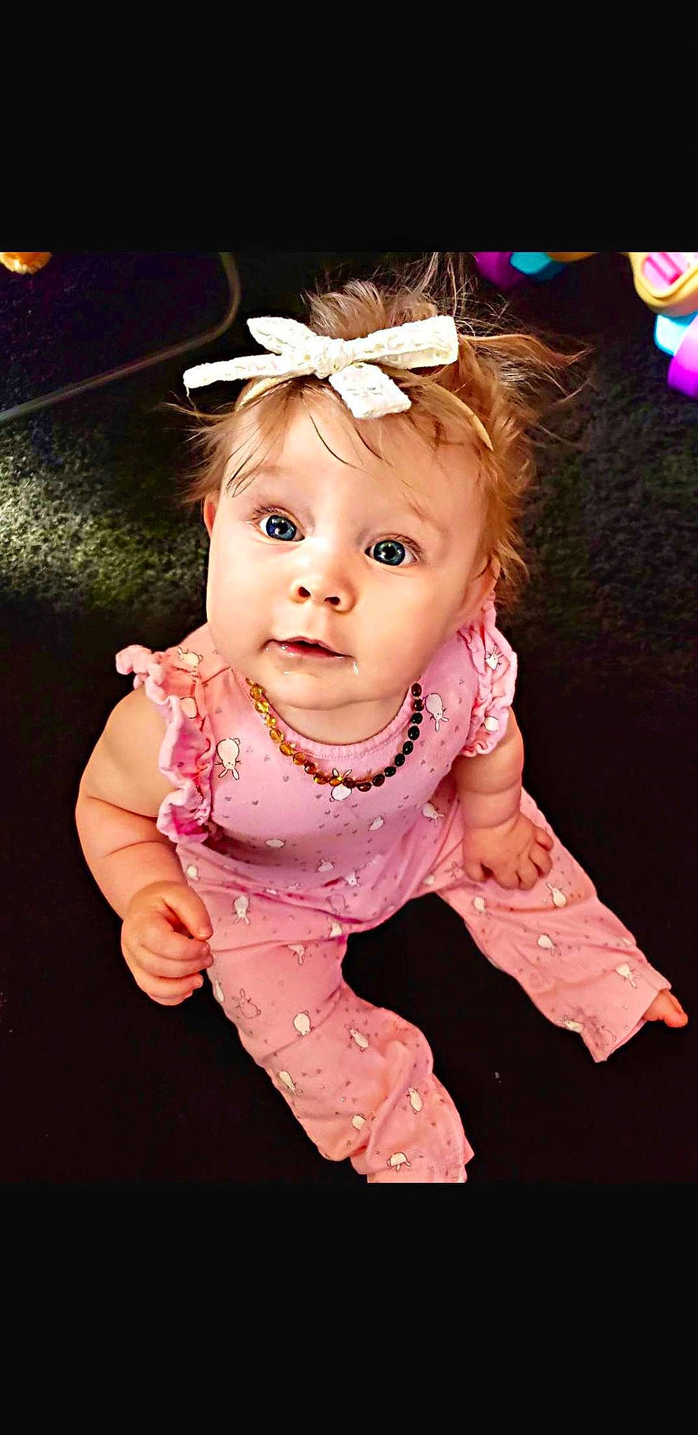 Coraleigh is registered to the contest to win money with this photo: baby, baby_toddler_clothing, cheek, chin, dress, eyelash, flash_photography, fun, happy, headband, iris, lip, magenta, person, petal, pink, purple, skin, sleeve, toddler