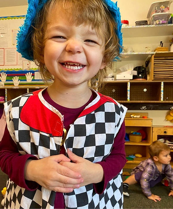 Lillyanna is registered to the contest to win money with this photo: baby_toddler_clothing, blue, child, event, fashion_accessory, fun, hair, hairstyle, happy, head, joy, organ, pattern, person, photograph, room, shelf, sleeve, smile, snapshot