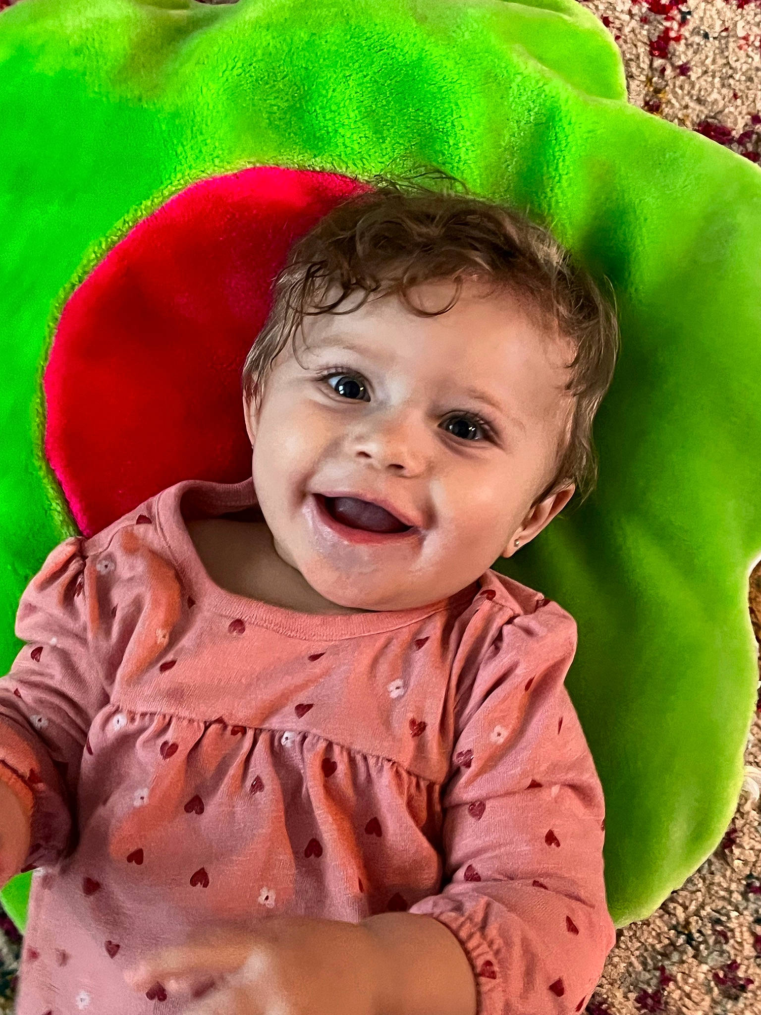 Amiyah is registered to the contest to win money with this photo: baby, baby_laughing, baby_toddler_clothing, cheek, grass, green, happy, head, human_body, joy, lip, mouth, nose, outerwear, people_in_nature, person, pink, skin, sleeve, smile